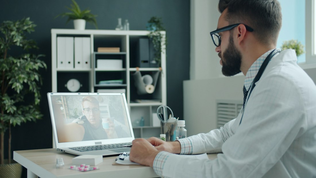 A clinician during a video consultation